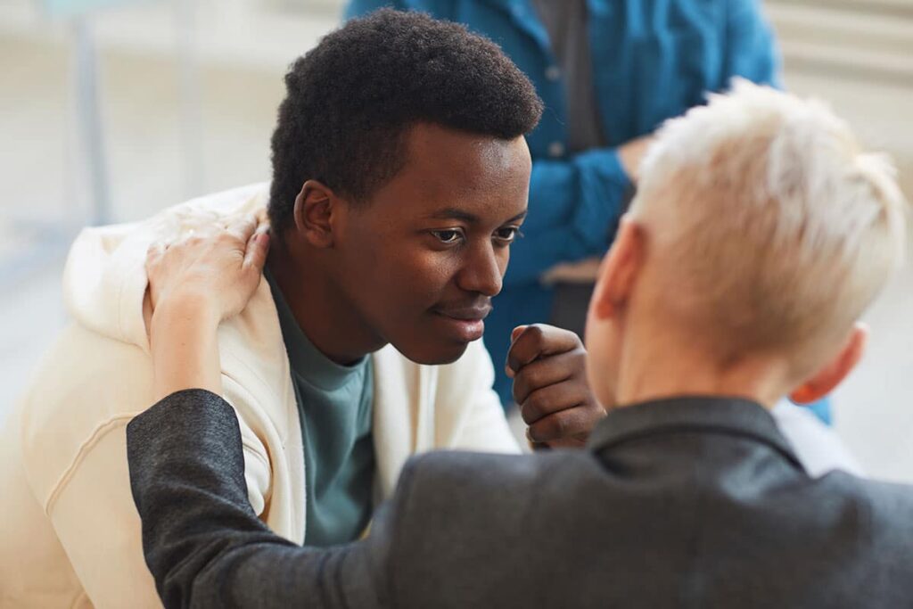 people participating in group therapy for teens