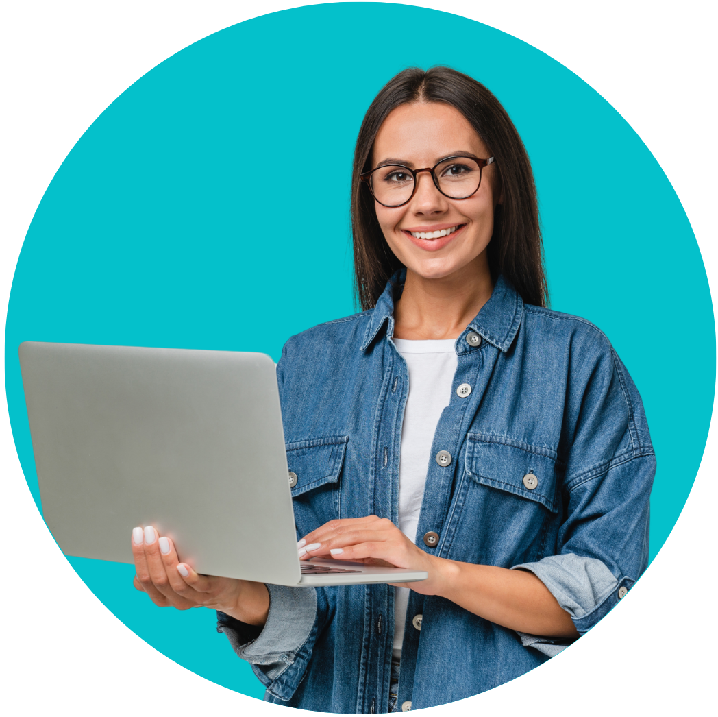 Smiling young woman with glasses holding a laptop