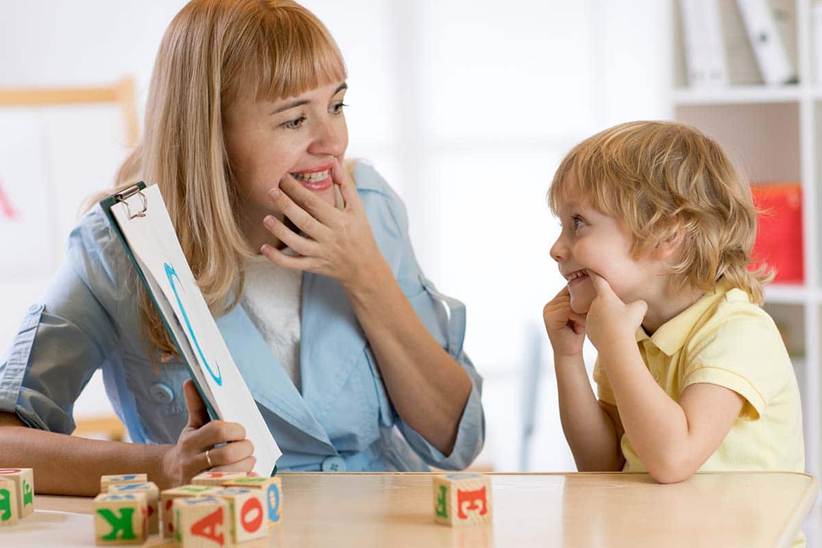 a woman works hard at day treatment for children