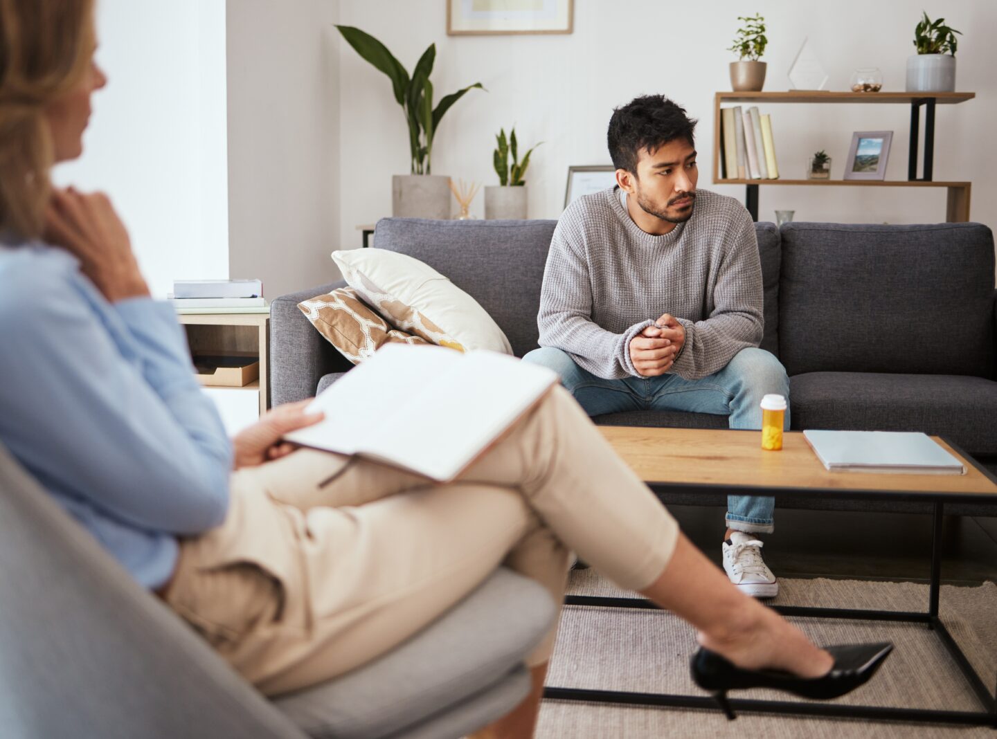 Teen speaking with a mental health professional during a counseling session
